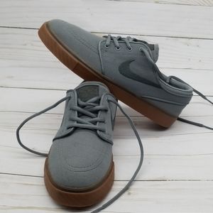 Nike Gray Athletic Shoes with Brown Sole
